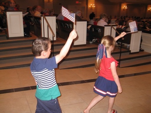 Children may participate in the flag waving!